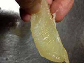 Carefully take a white thin membrane of the herring roe