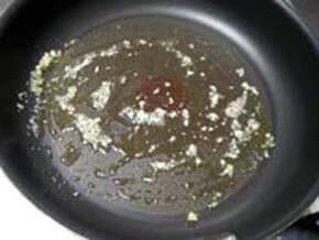 Heat the oil in a frying pan and stir fry the garlic
