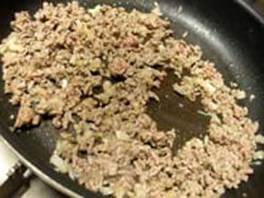 Add mixture of ground beef and pork, and salt and pepper when the color changes