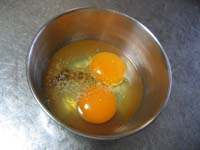 Put eggs into a bowl.Stir soy sauce,sugar,salt, and pepper into the bowl